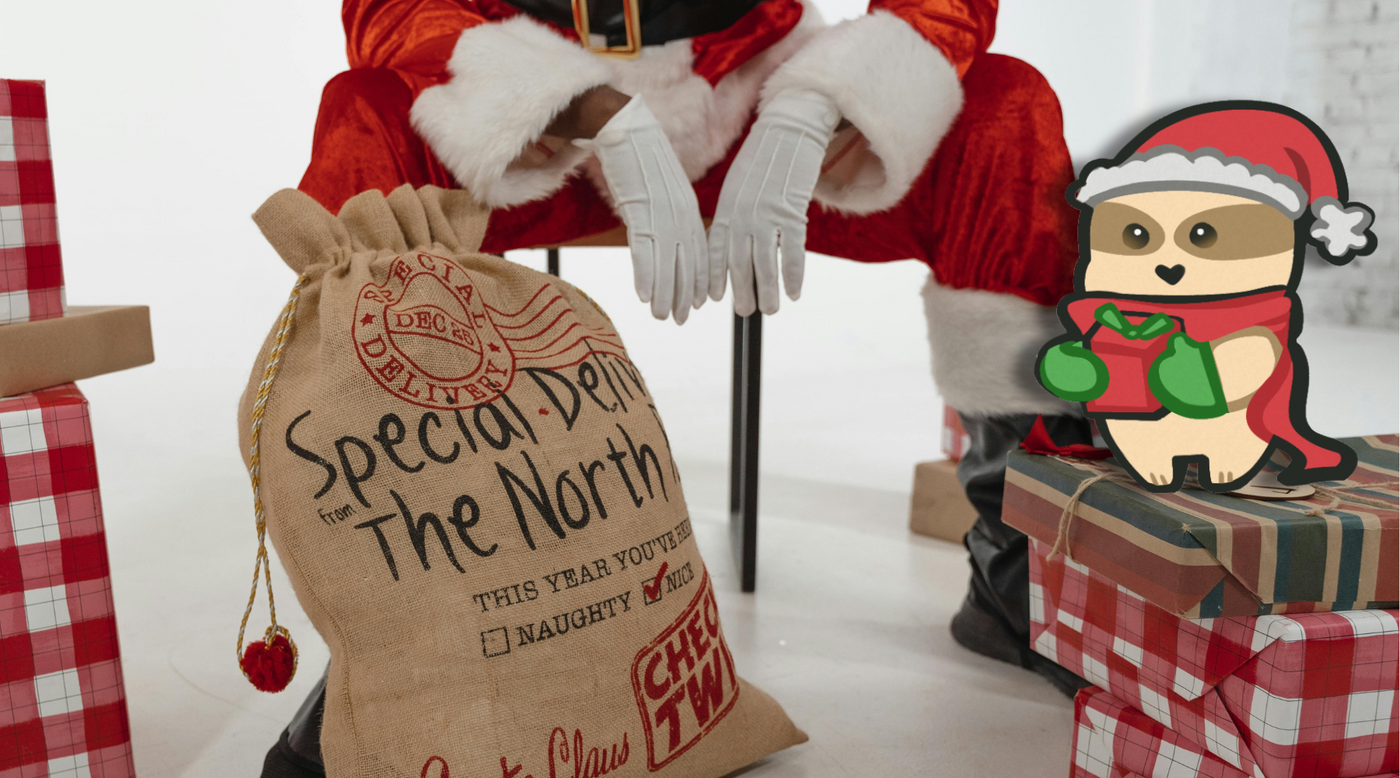 Sloth standing with Santa near Christmas boxes